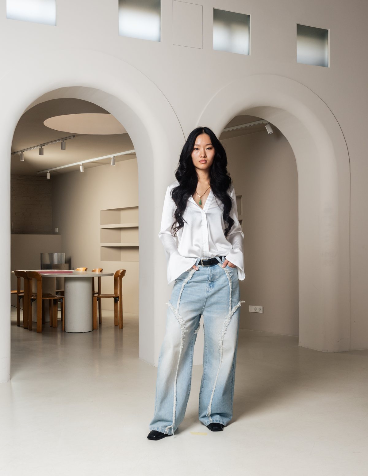 VERA Volume 01 — wide-leg light blue denim with raw front seams.